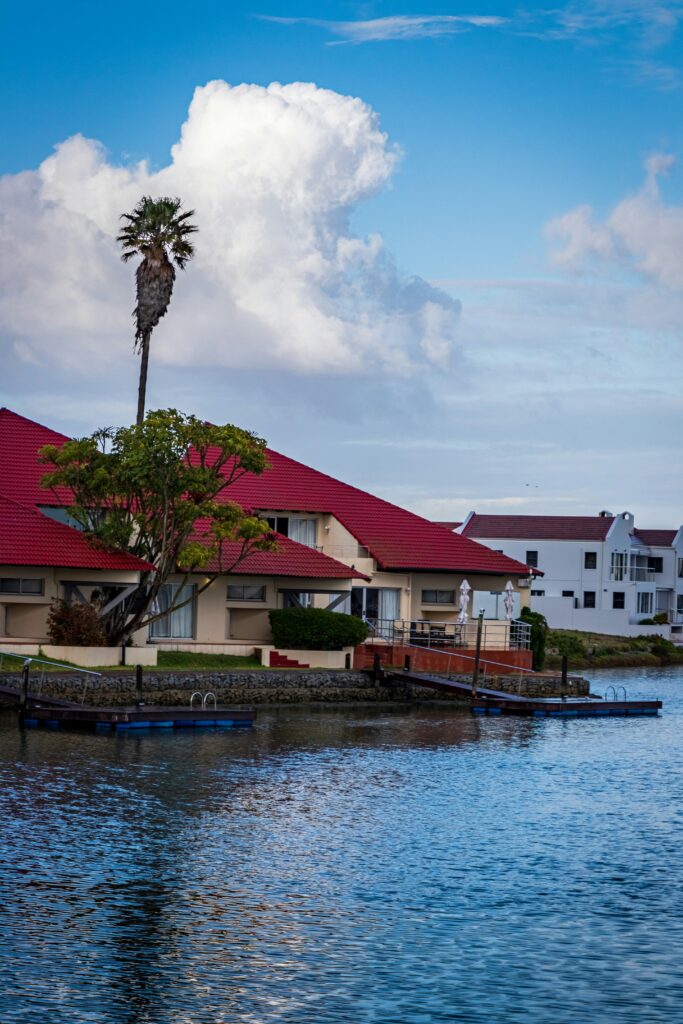 Red roofed villa by the river.