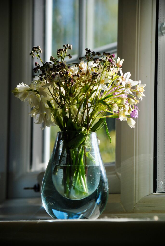Bouquet of blooms in a glass vase.