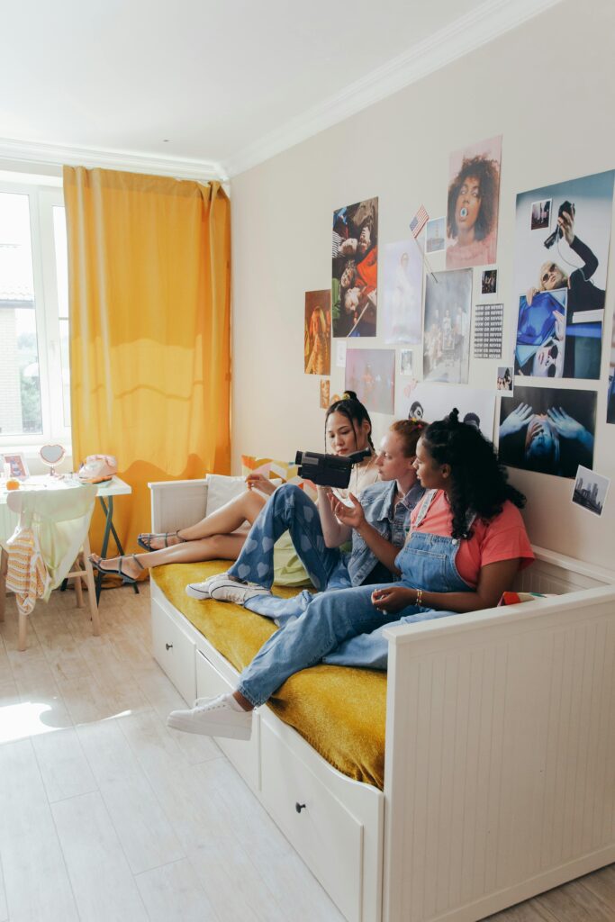 3 Teenagers in bedroom.