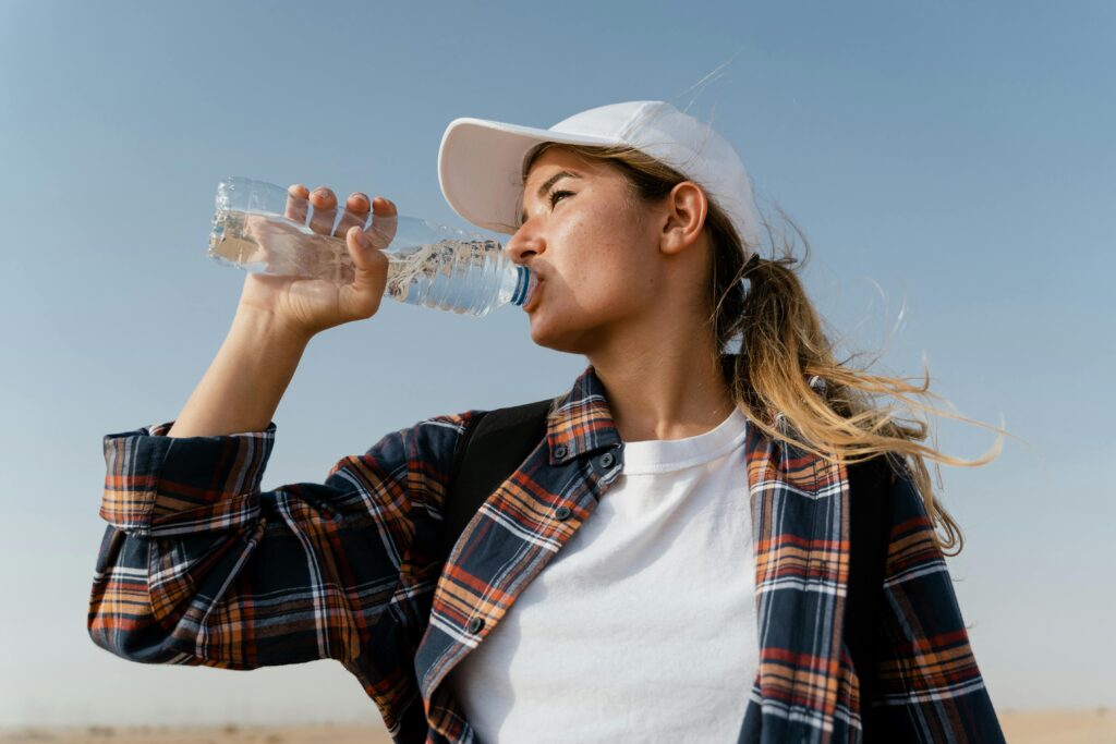 Woman drinking water.