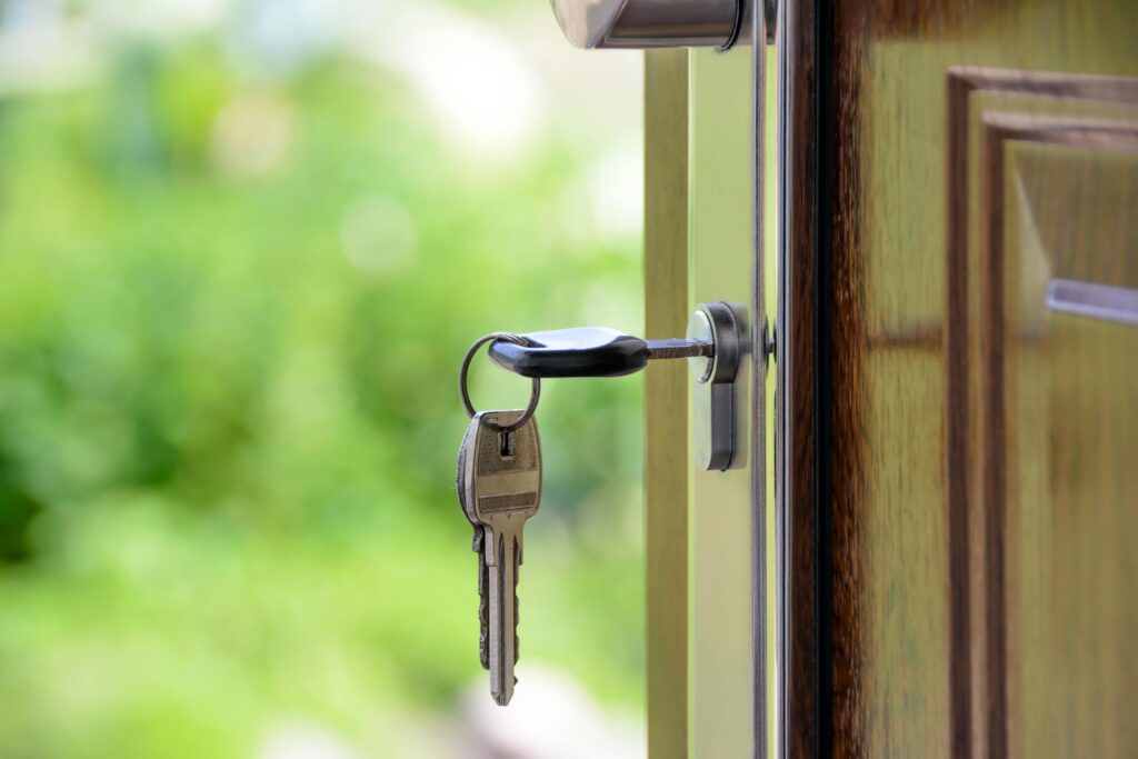 Image of a key in a door. This is to go with an article discussing why house sales fall through.