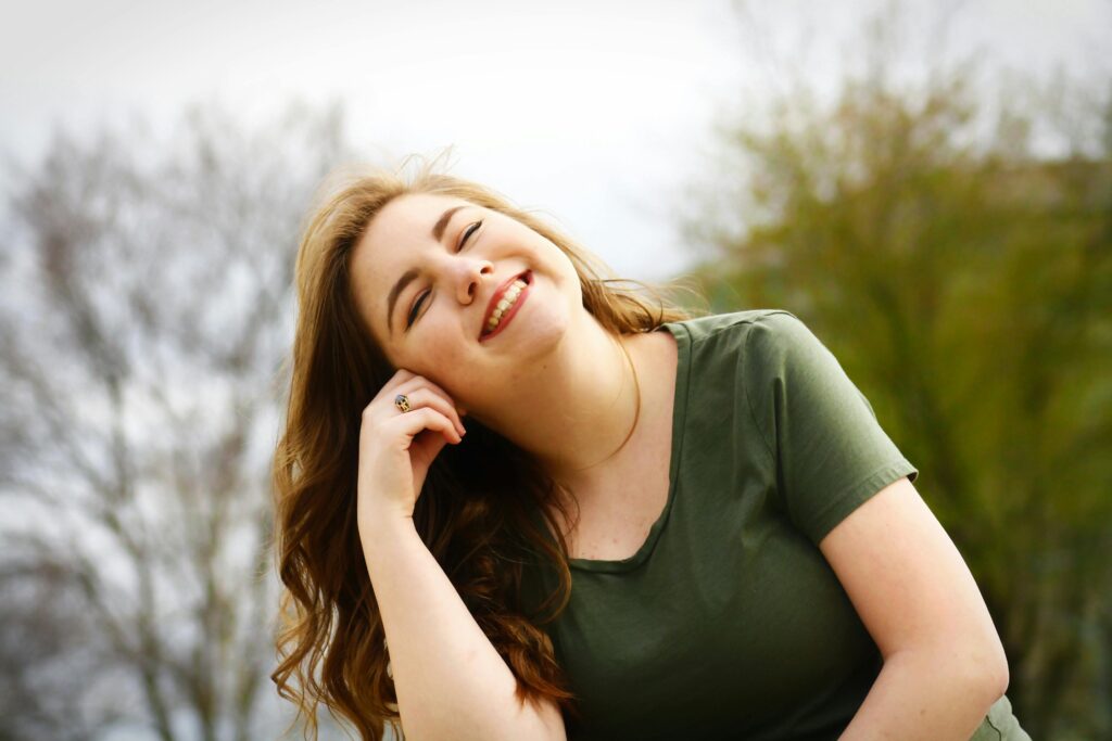 Happy woman. This is to go with an article discussing how to feel more comfortable in your body.