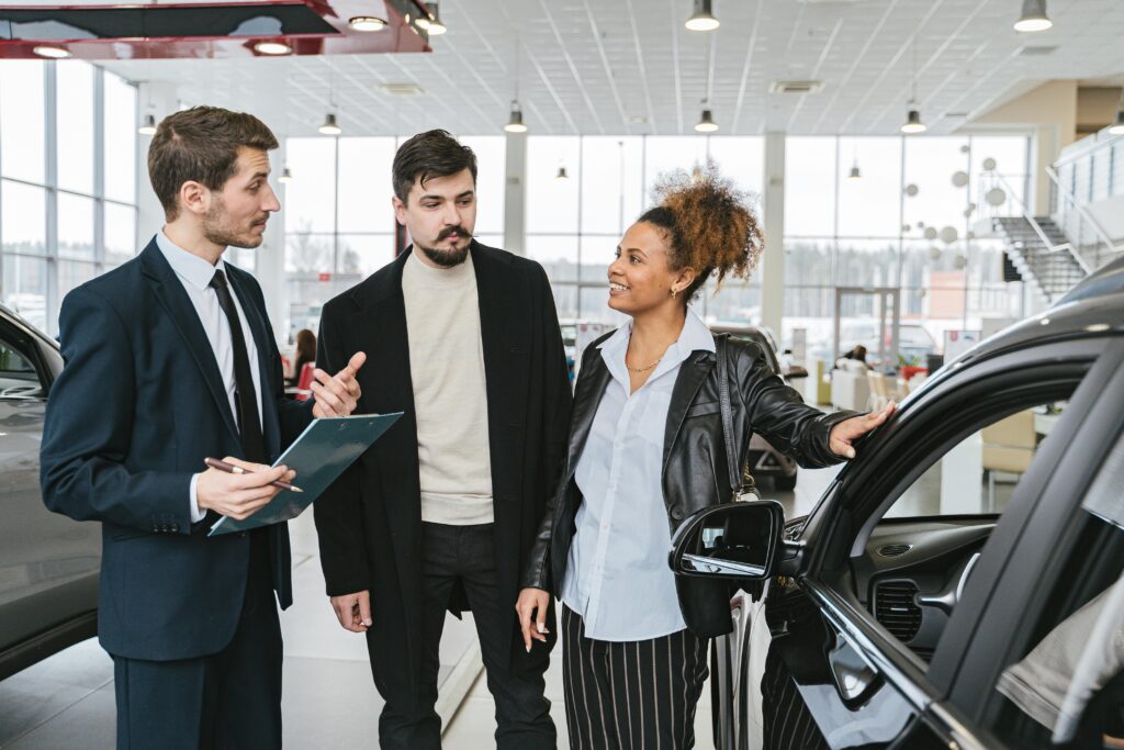 Couple buying a used car.