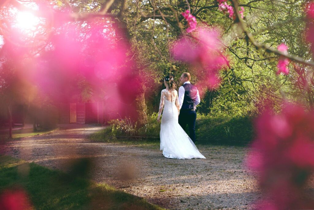 Bride and groom walking away from the camera.