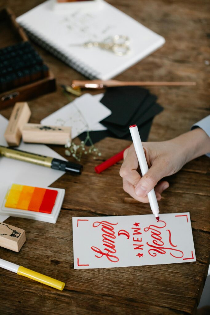 Person designing a new years greeting card.