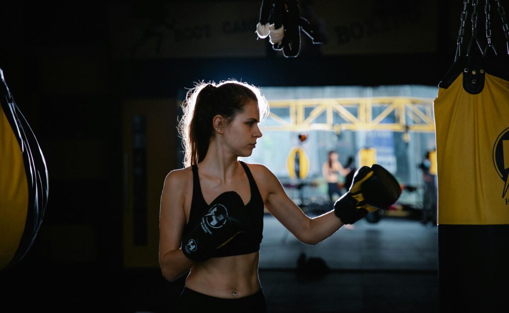 Woman taking part in a kickboxing lesson.