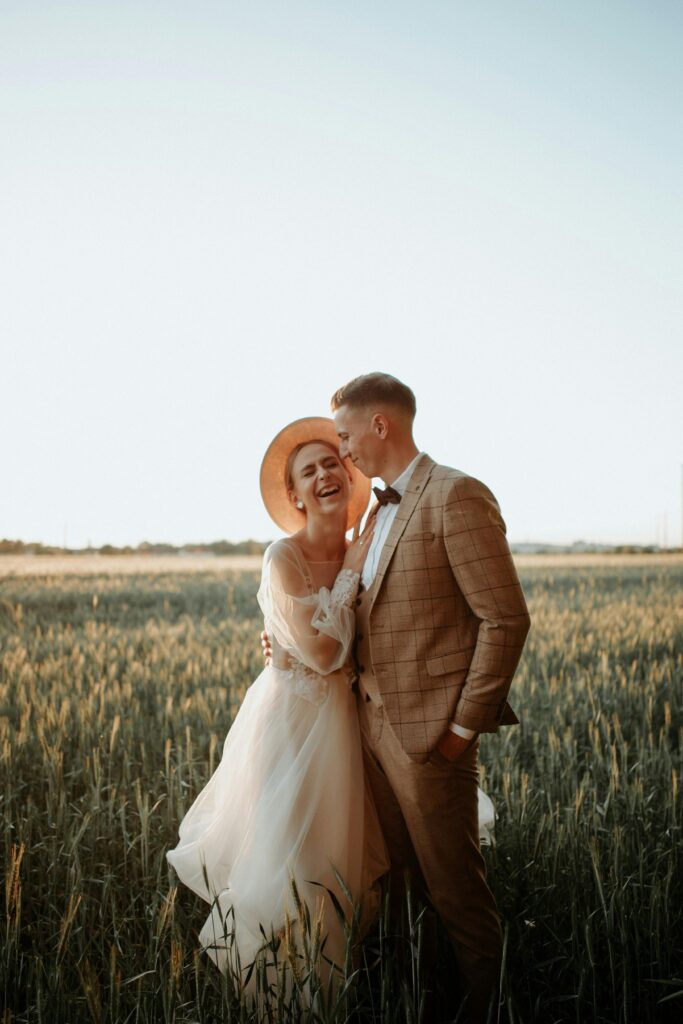 Couple getting married in a wheat field.