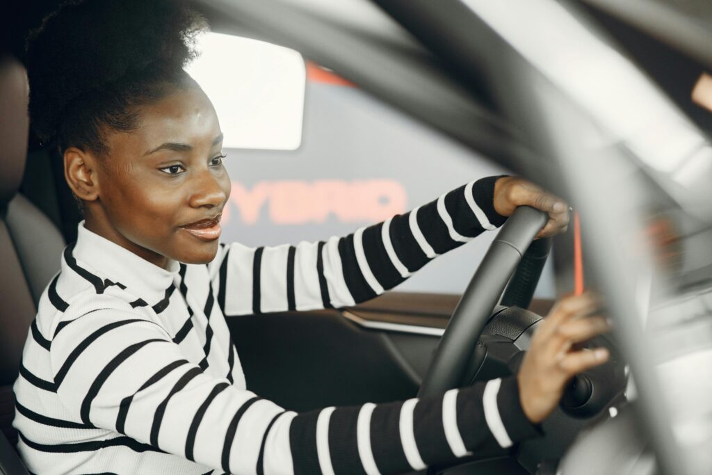 Woman driving a car. This is to go with an article discussing car insurance.