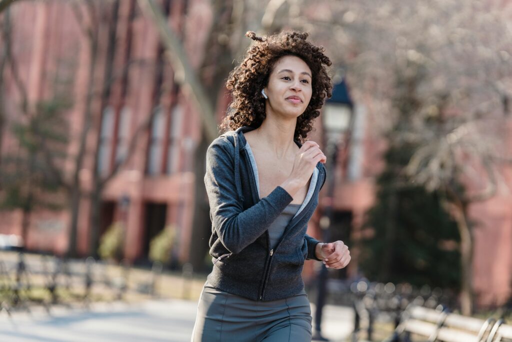 Woman running through the park.