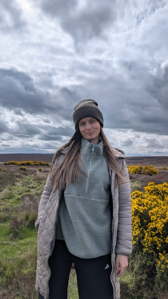 Claire Mac wearing spring layering in the North Yorkshire Moors.
