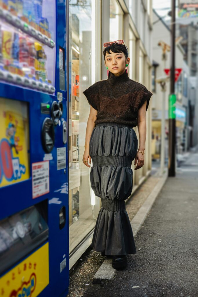 Lady wearing all black Japanese fashion outfit.