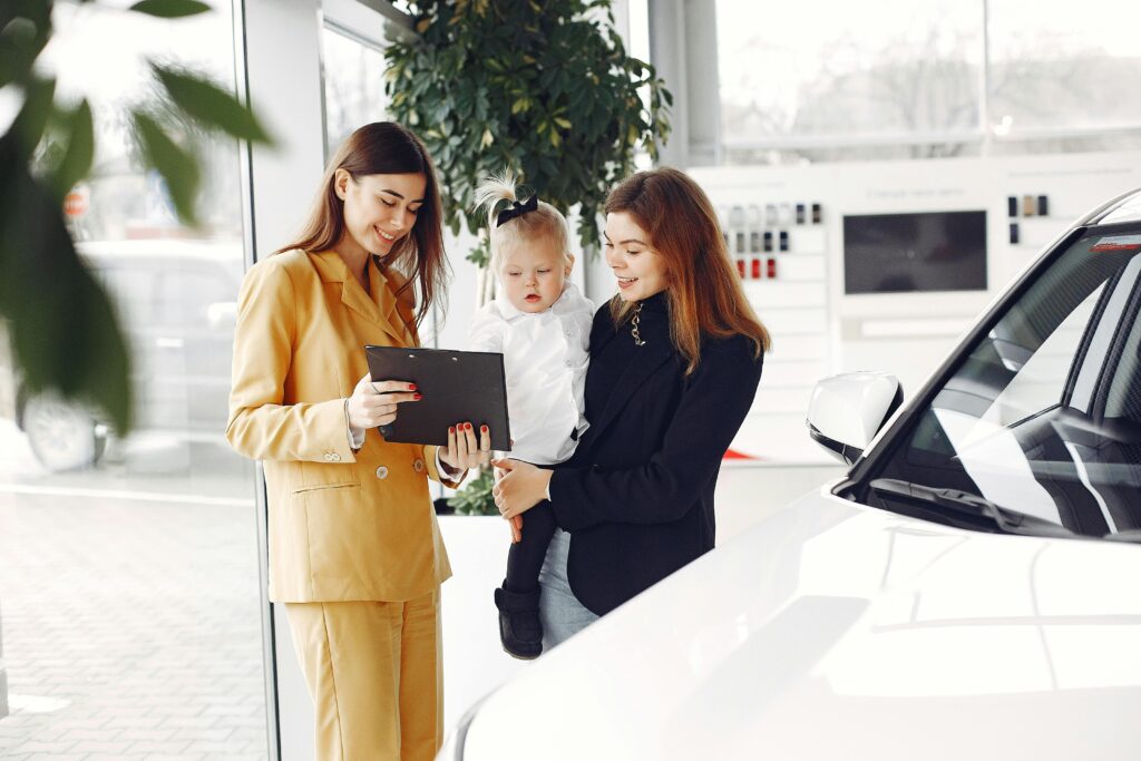 Woman choosing the best car to buy for her family.