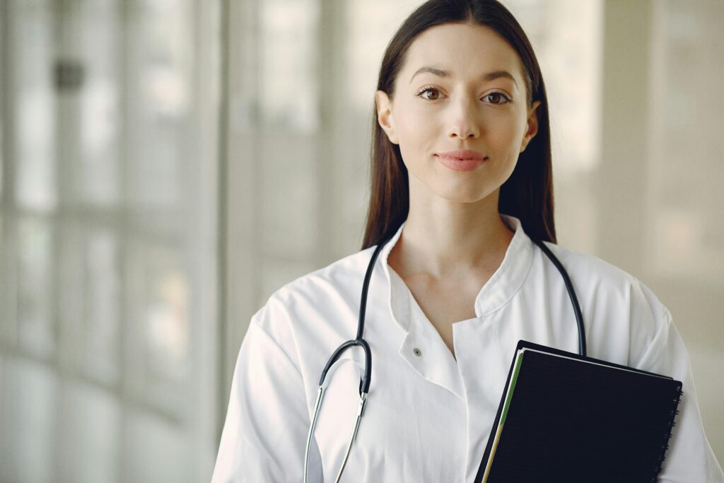 Woman wearing a healthcare practice uniform.