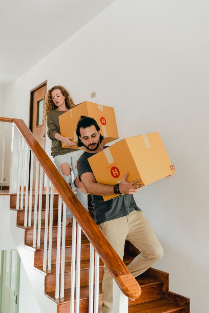 Couple packing boxes after a home purchase