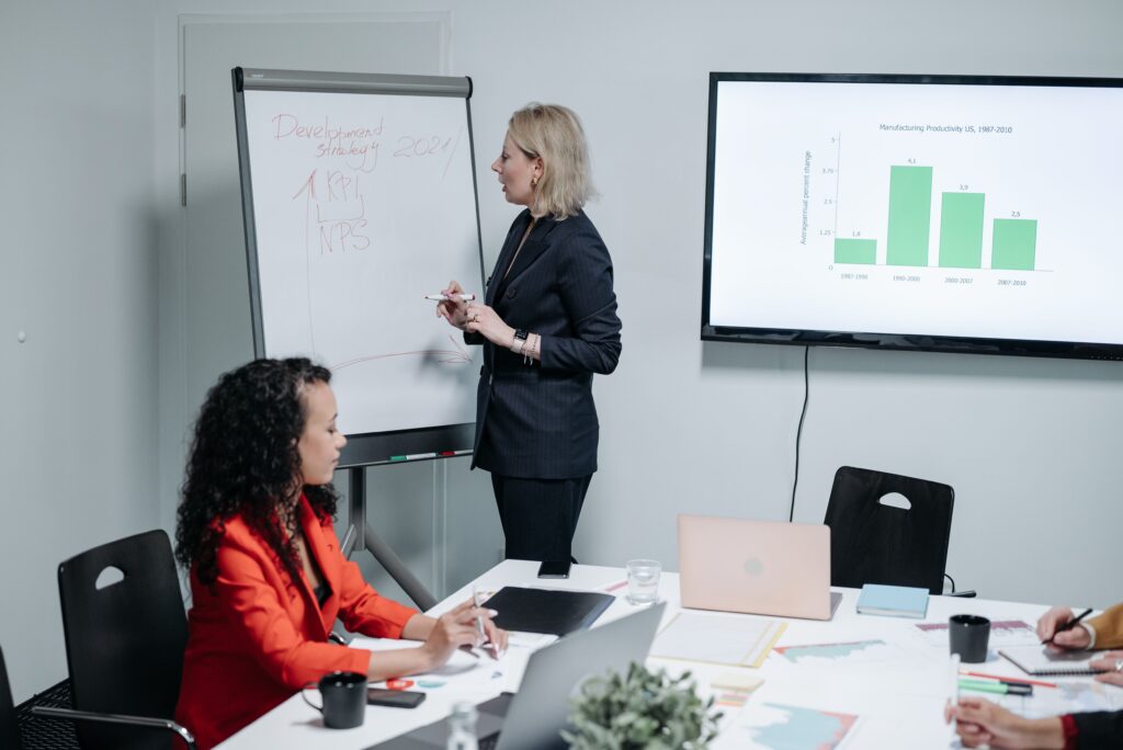 Business women discussing business KPIs.