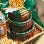 Colorful and festive gift baskets wrapped with green and gold ribbons for special celebrations.
