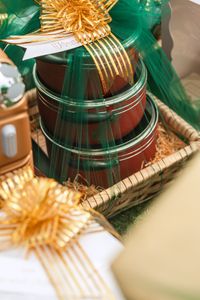 Colorful and festive gift baskets wrapped with green and gold ribbons for special celebrations.