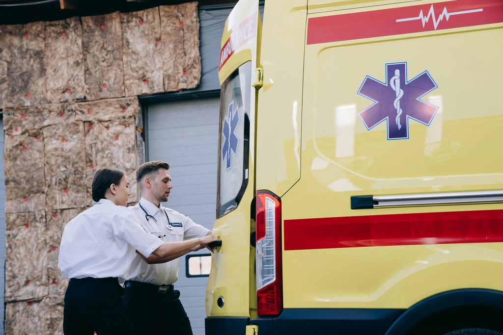 Ambulance staff dealing with medical health emergencies.