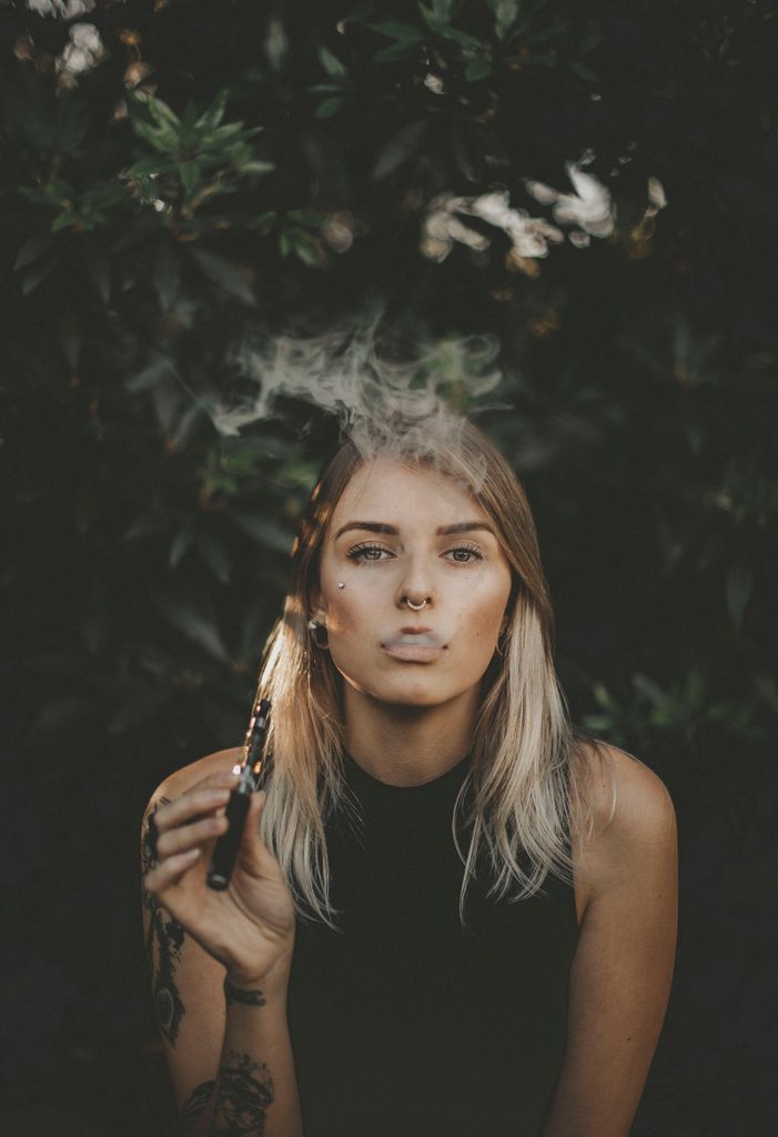 Woman smoking a vape. This is to go with an article about Cigalike.