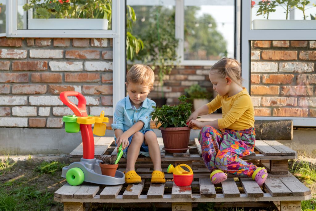 Kids in an outdoor play space setting.
